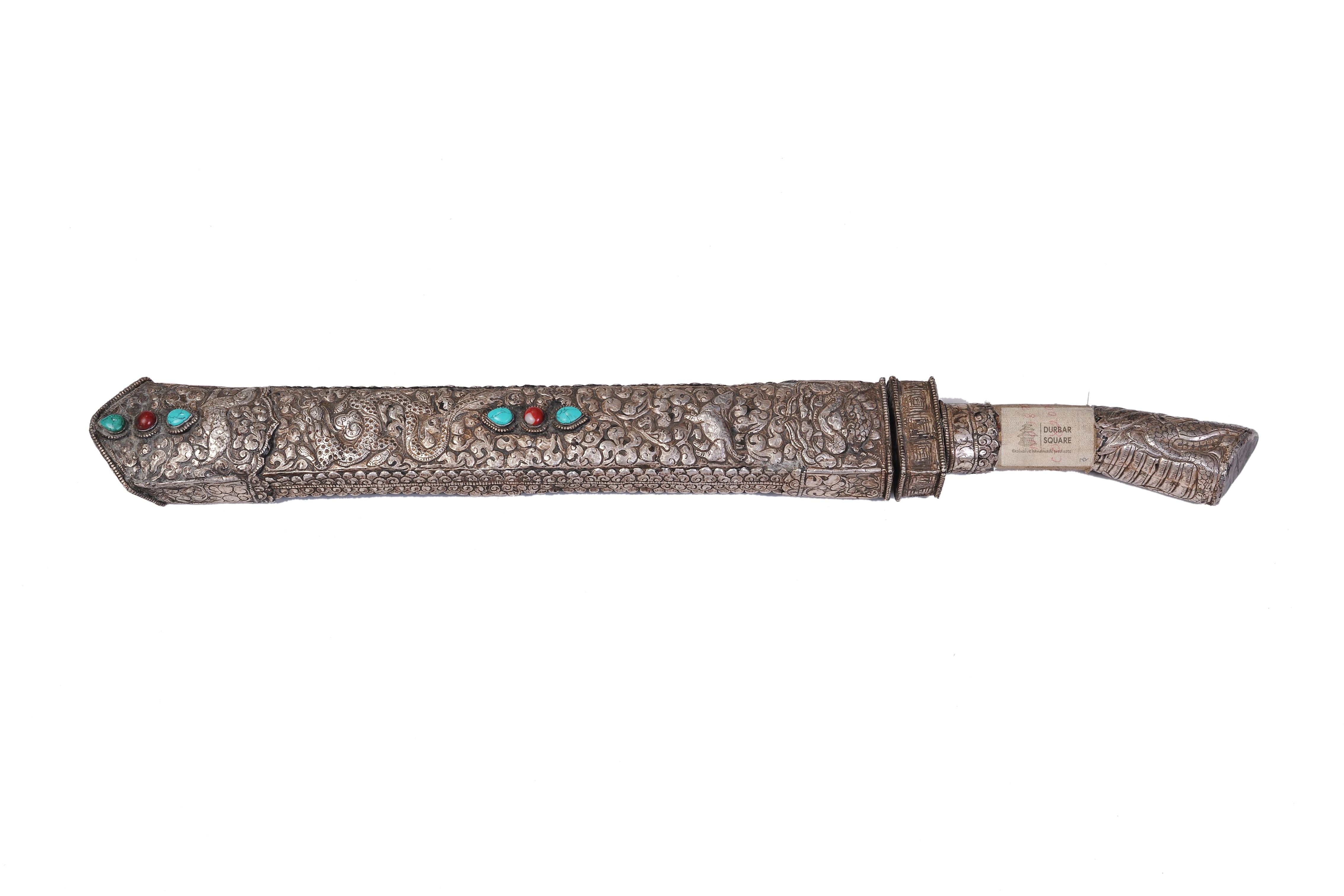 Silver-covered dagger in a chased silver sheath inlaid with turquoise and coral stones