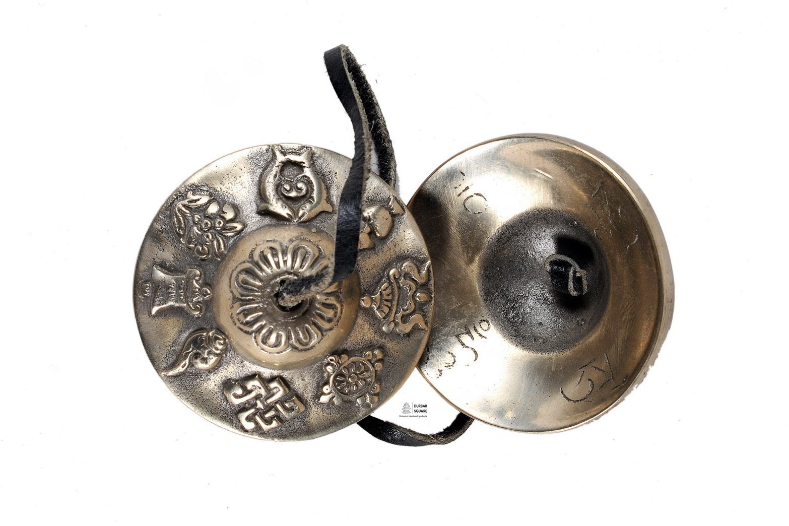 Pair of bronze tingshya cymbals on a leather strap, one face engraved with the eight auspicious symbols