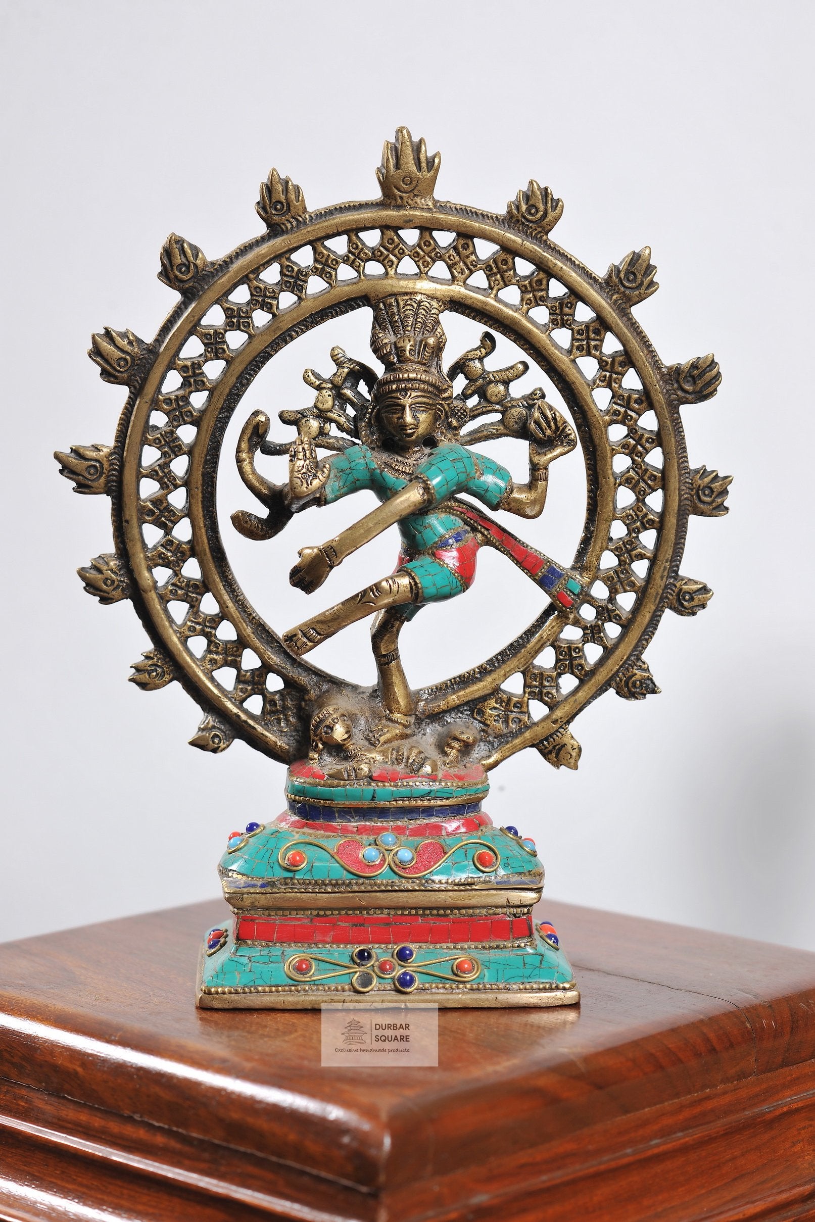 Handcrafted bronze Natraj statue with turquoise and red semi-precious stone inlay, dancing within a circular openwork aureole