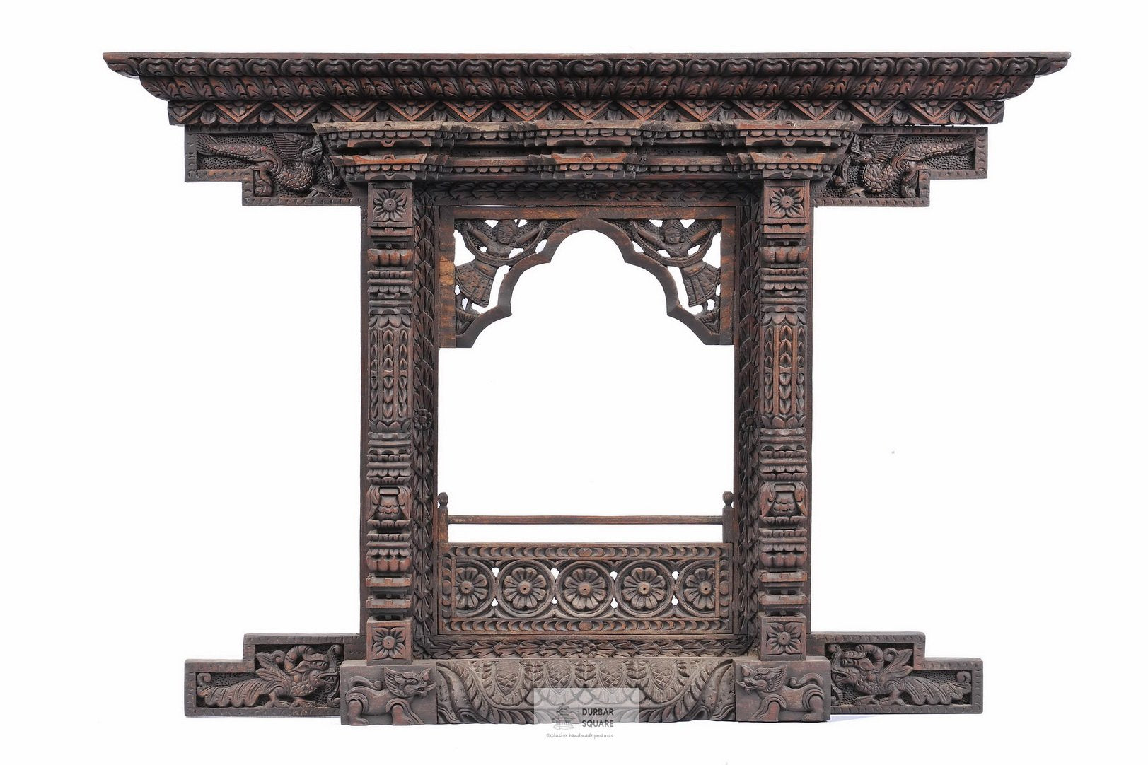 Large carved wooden Kumari window with an open centre, carved arch and floral rosette lower panel