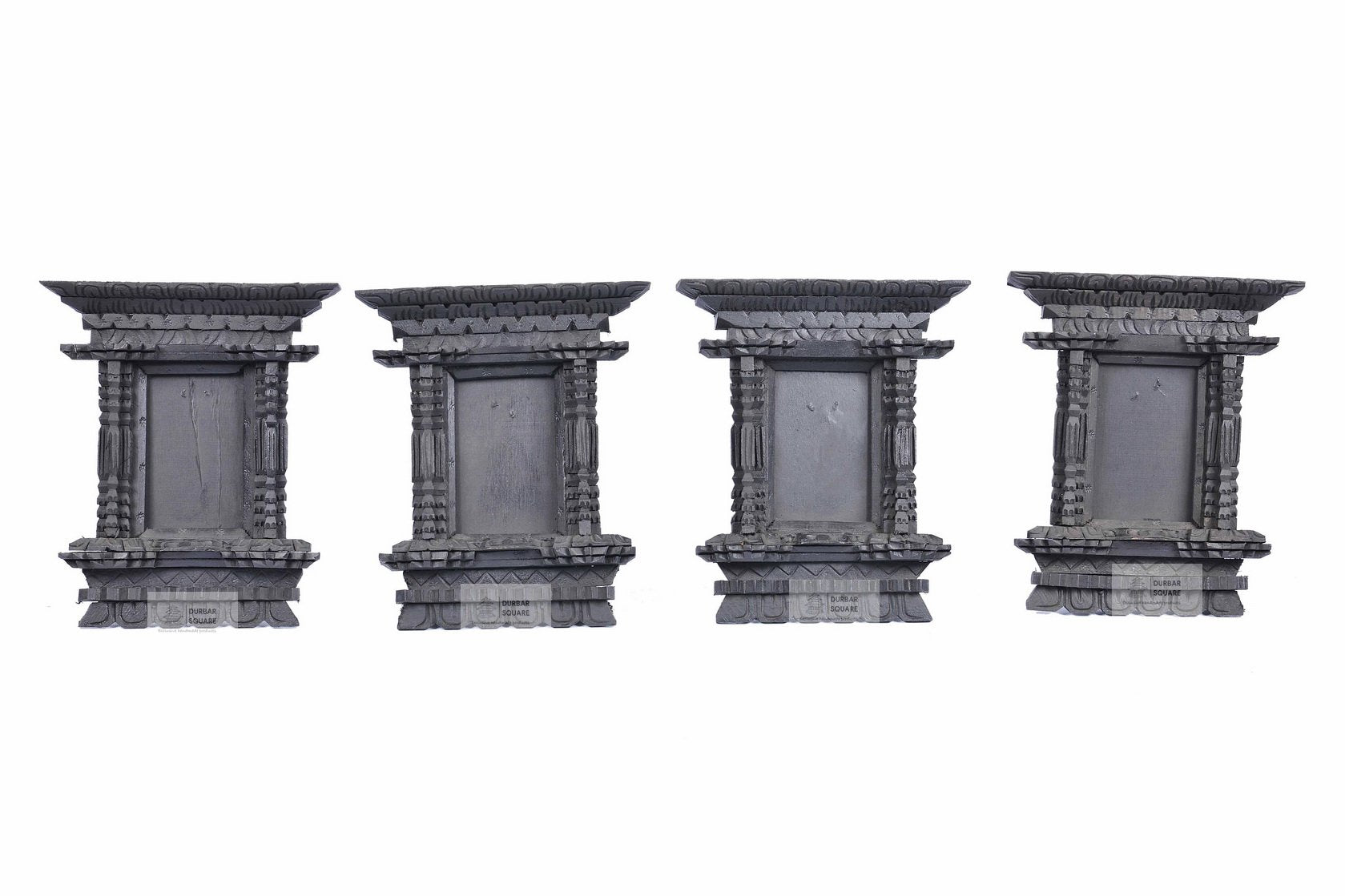 Listing photograph showing four sample hand-carved dark wooden Ankhi Jhyal frames; the set sold contains three